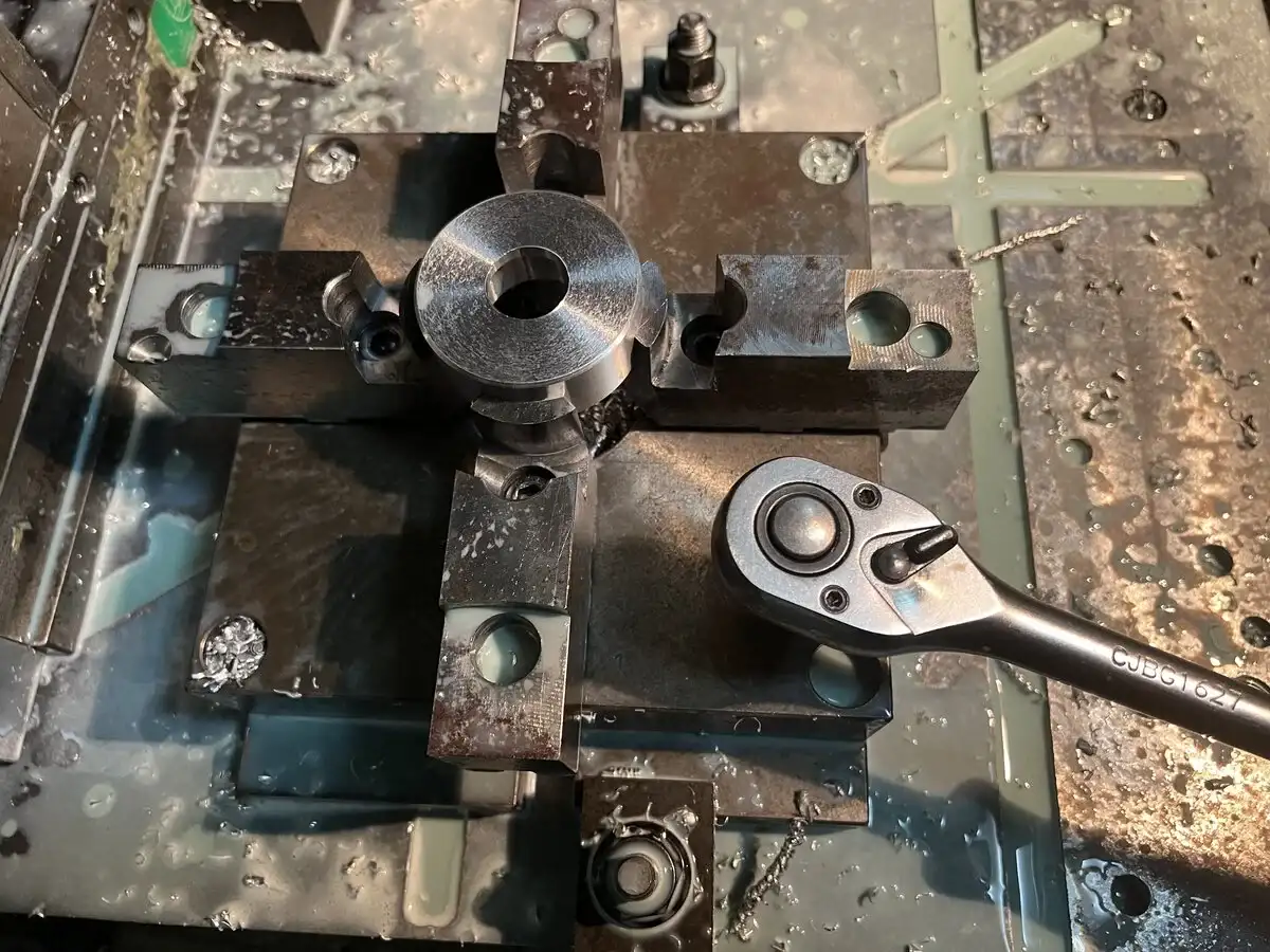 Using  a Square chuck is an easy way to hold round parts on a VMC